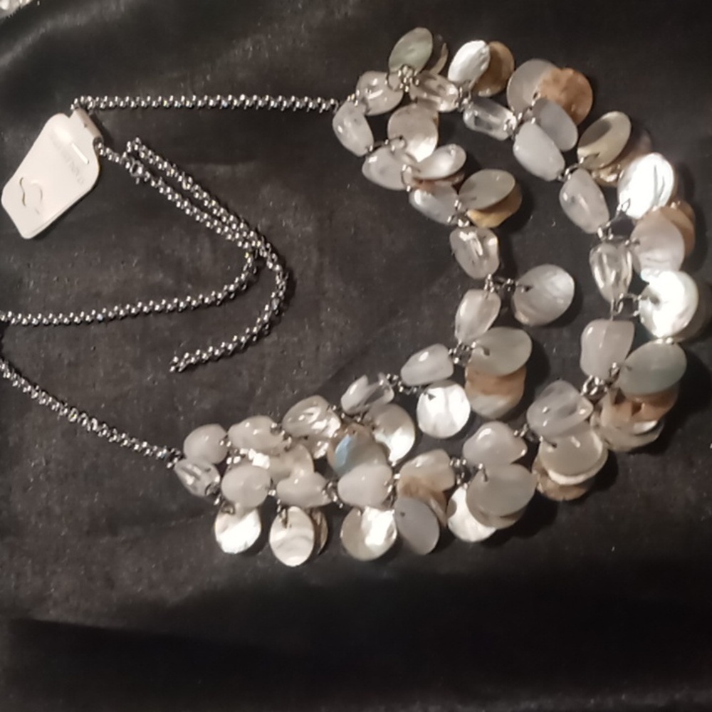 Mother of pearl & white marbled color beads on a stainless steel rolo chain.